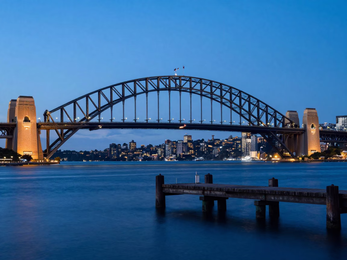 Sydney Harbour Bridge at Blue Hour with Bridge Pier in Still Water in in Sydney, New South Wales, Australia