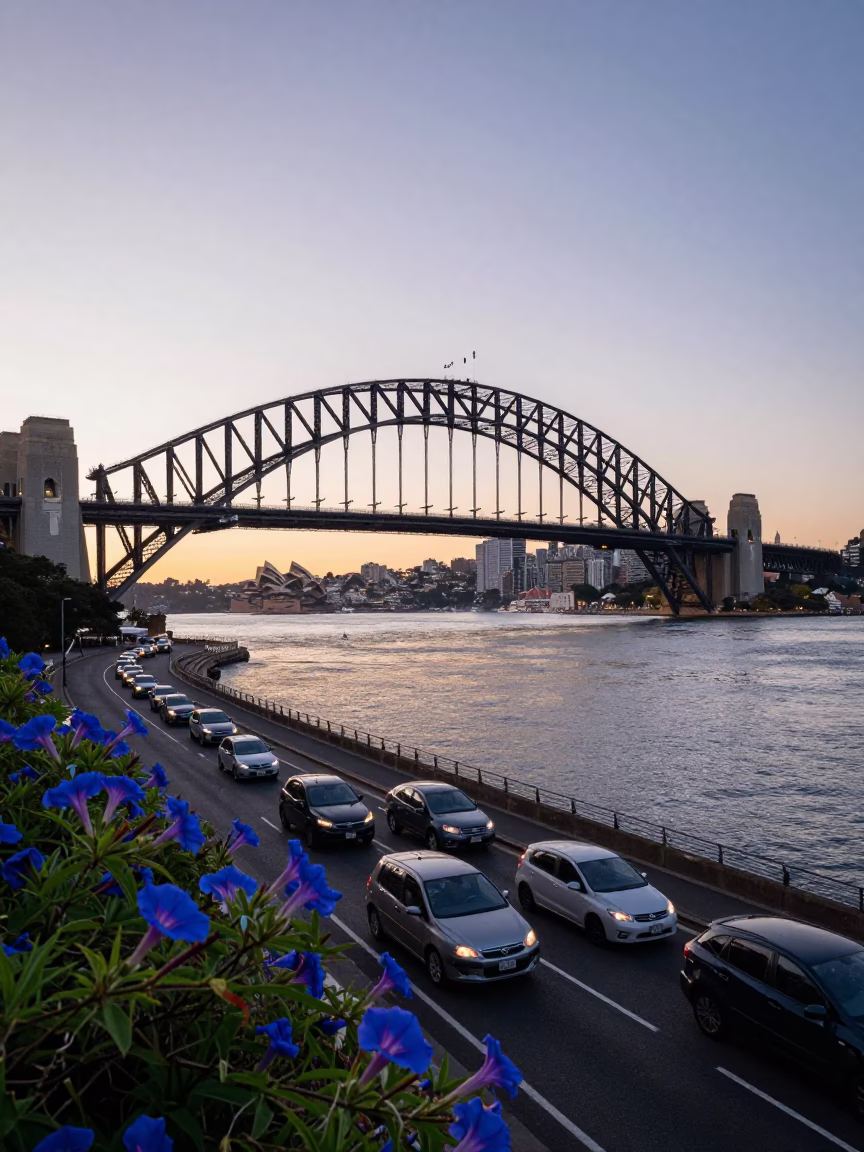 Sydney Harbour Bridge Early Morning Commute with Morning Glory Clouds Over Water in in Sydney, New South Wales, Australia