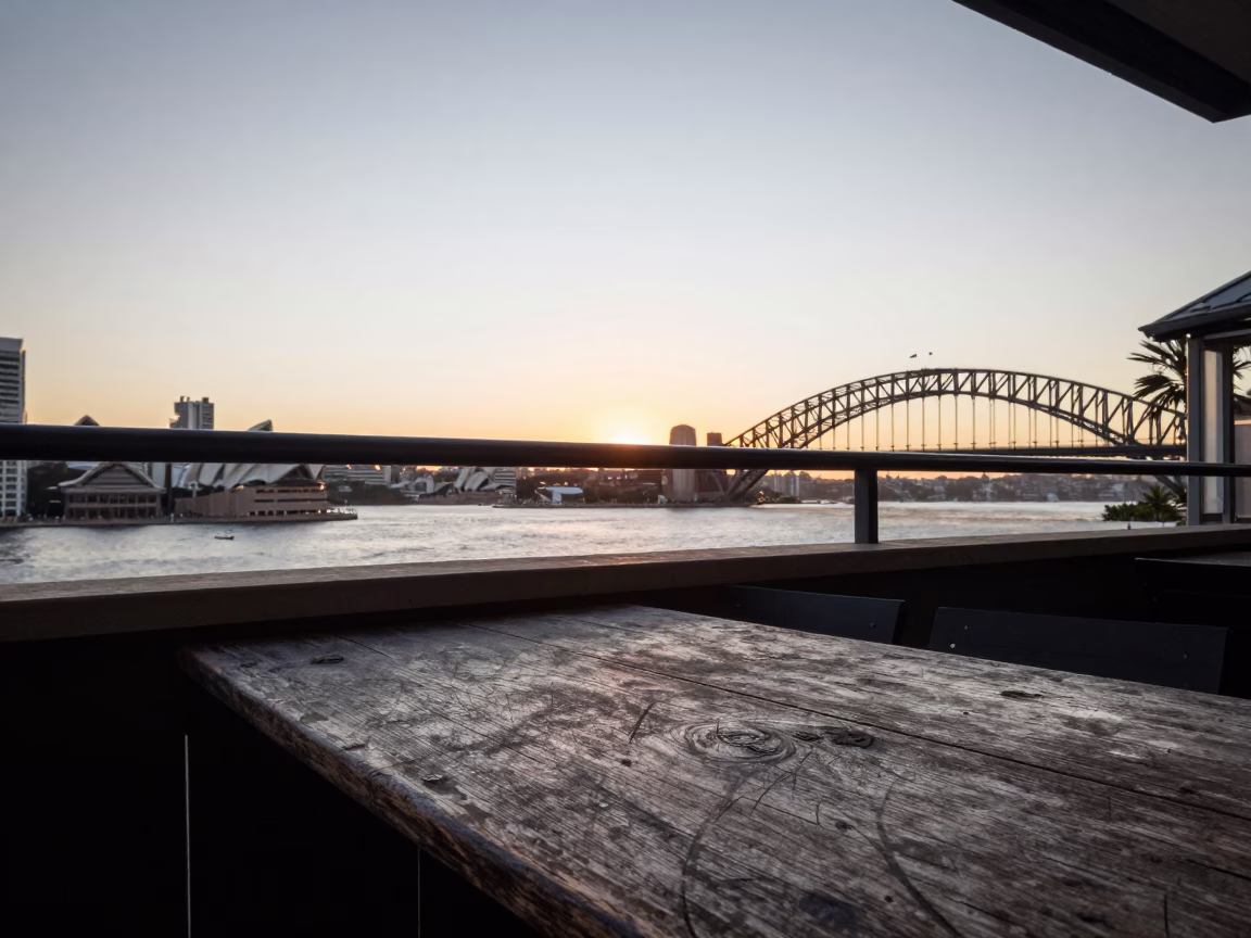 Sydney Harbour Sunset View from Balcony with Worn Wood Table and Peaches in in Sydney, New South Wales, Australia