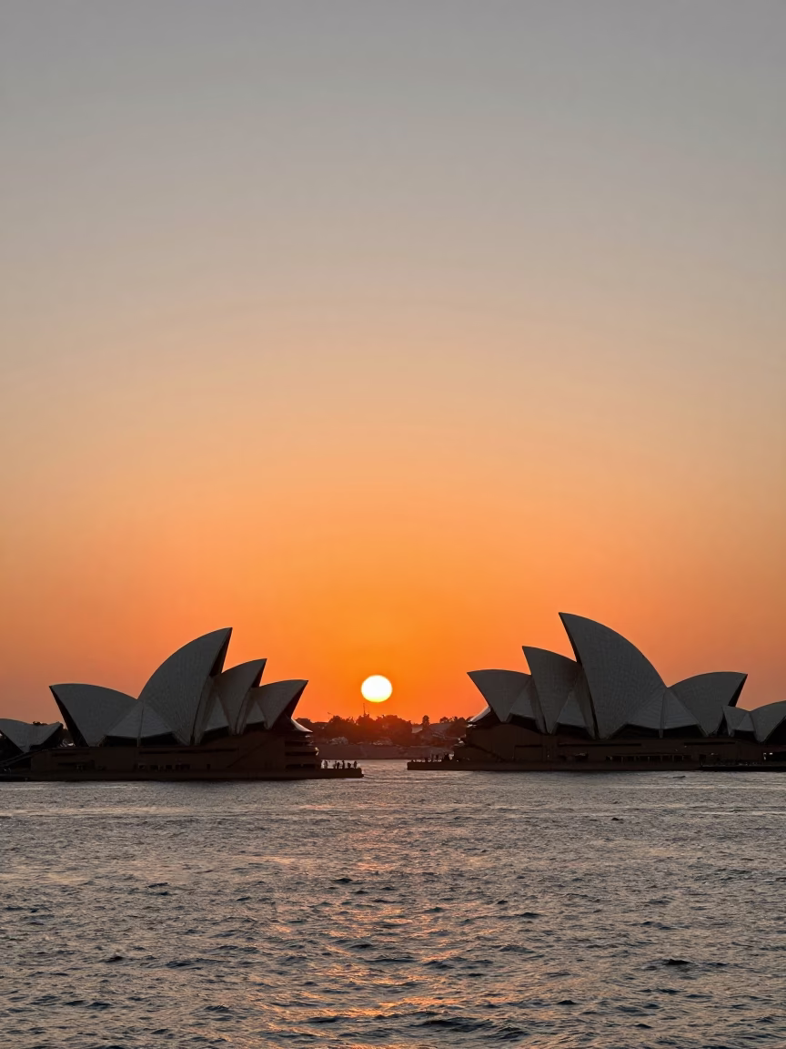 Sydney Harbour sunset with Opera House sails and tanker ship at Barangaroo dock in in Sydney, New South Wales, Australia