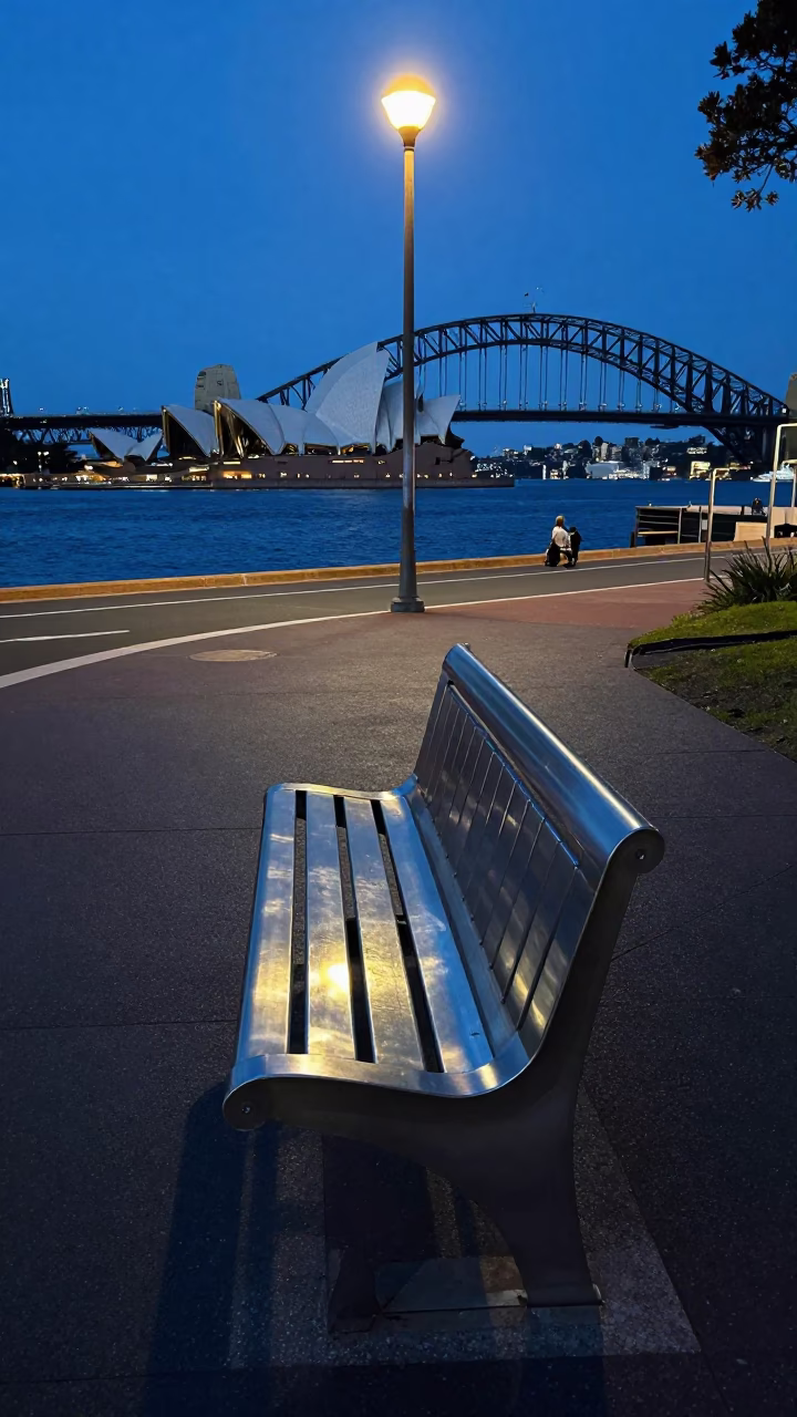 Sydney Harbour Twilight Street Scene with Brushed Steel Bench and Potted Geraniums in in Sydney, New South Wales, Australia