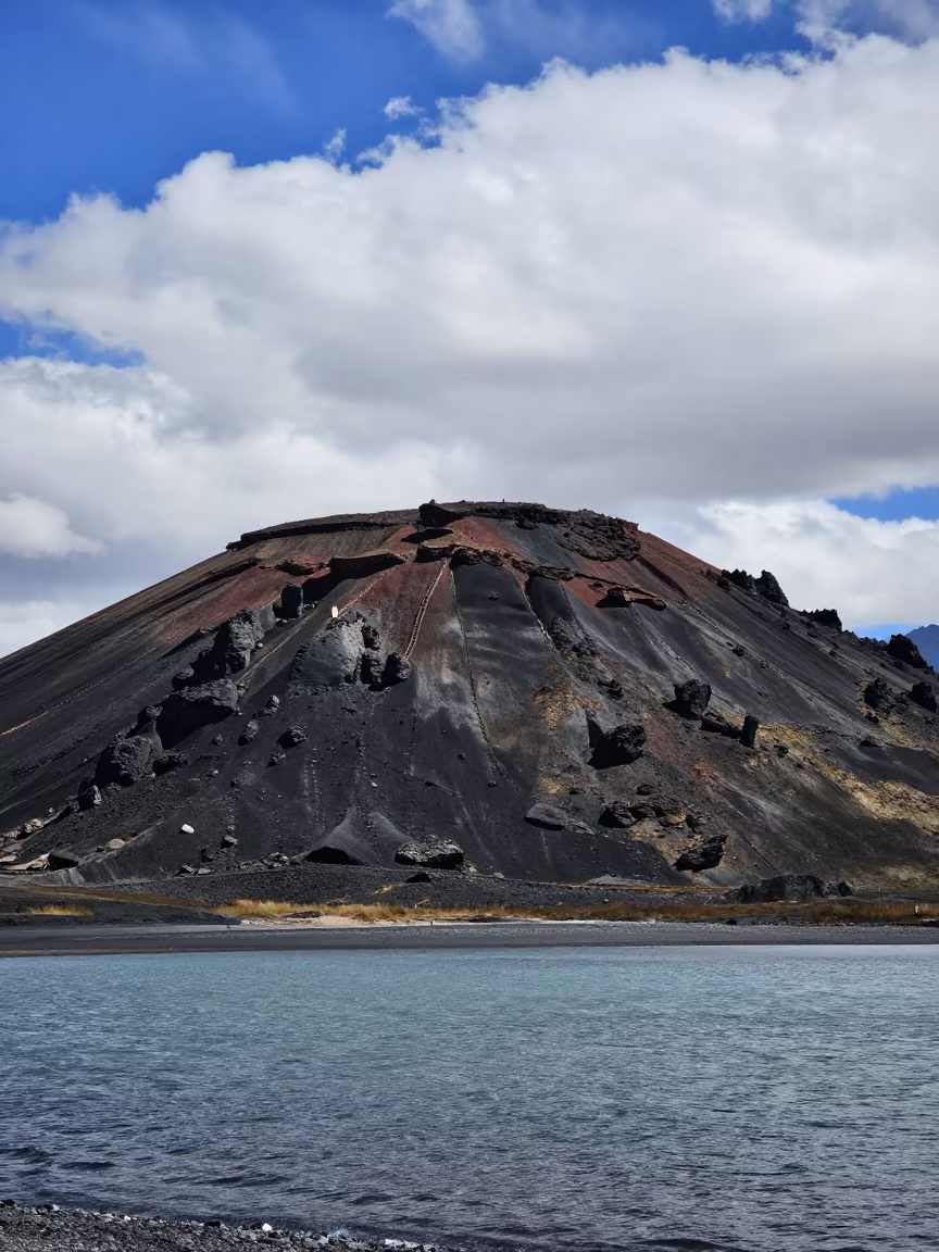 Symmetrical Volcanic Cone Against Blue Sky in along a wave-cut shoreline near Barkhor, Lhasa