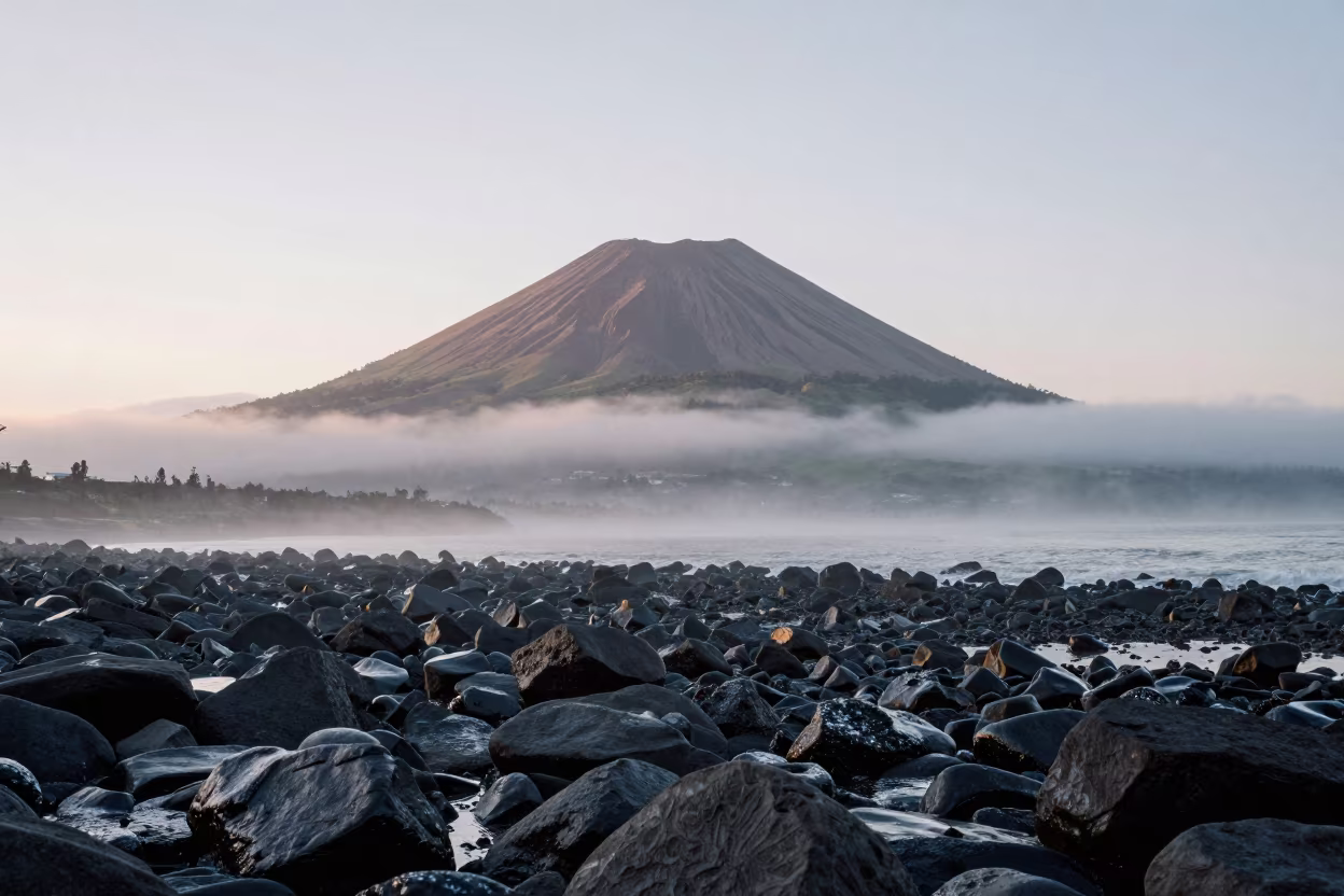 Symmetrical Volcanic Cone at Winter Dawn Mist in along a wave-cut shoreline near Guapulo, Quito