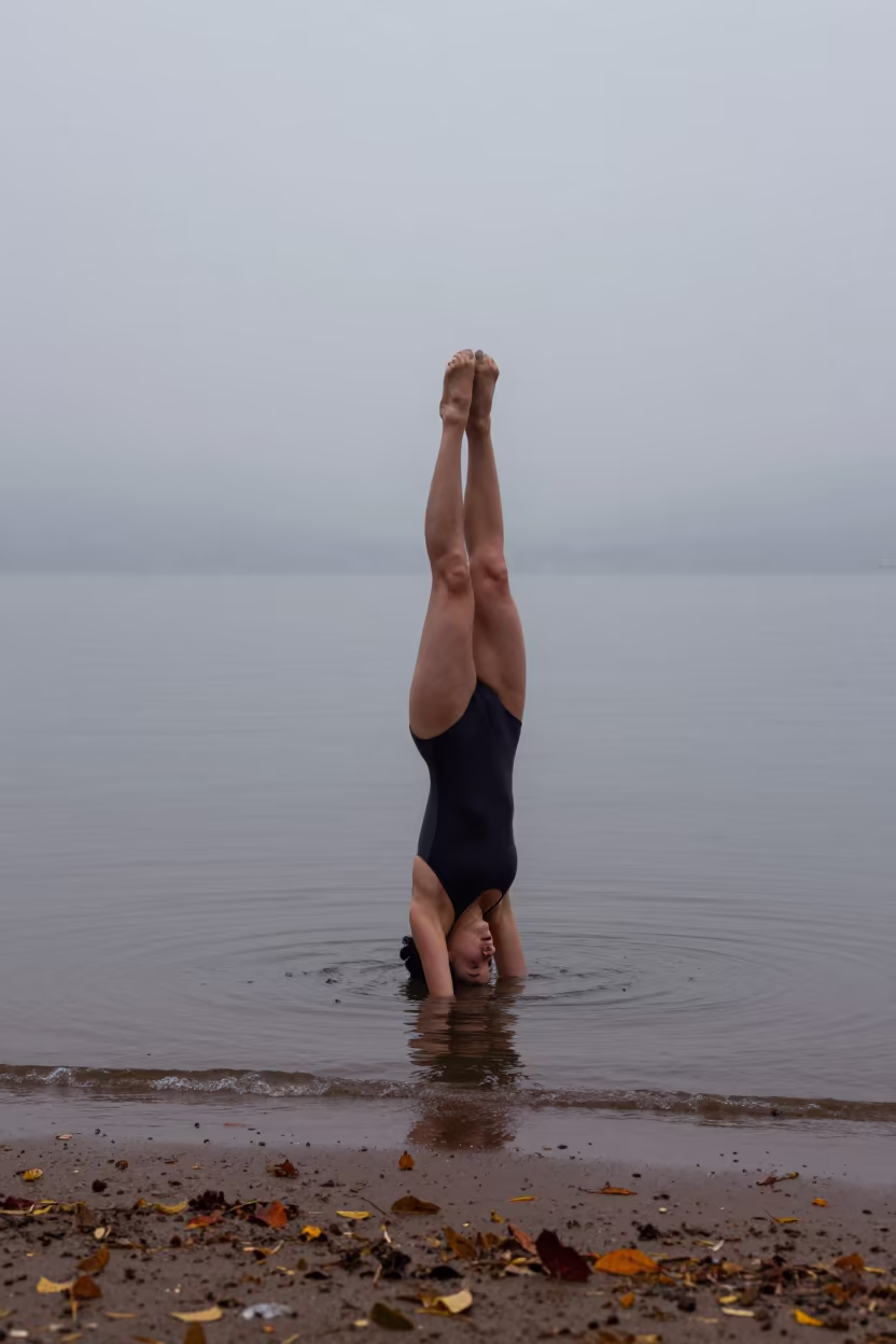 Synchronized Swimmer Inverted in Misty Autumn Dawn in along a beach near Hangzhou