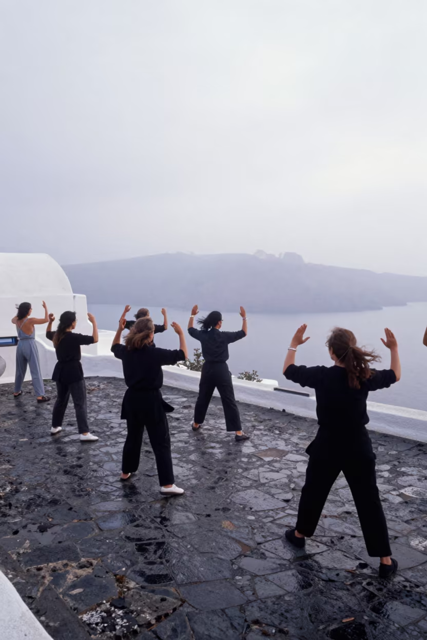 Tai Chi Group Moves Through Santorini Morning Mist in in Santorini