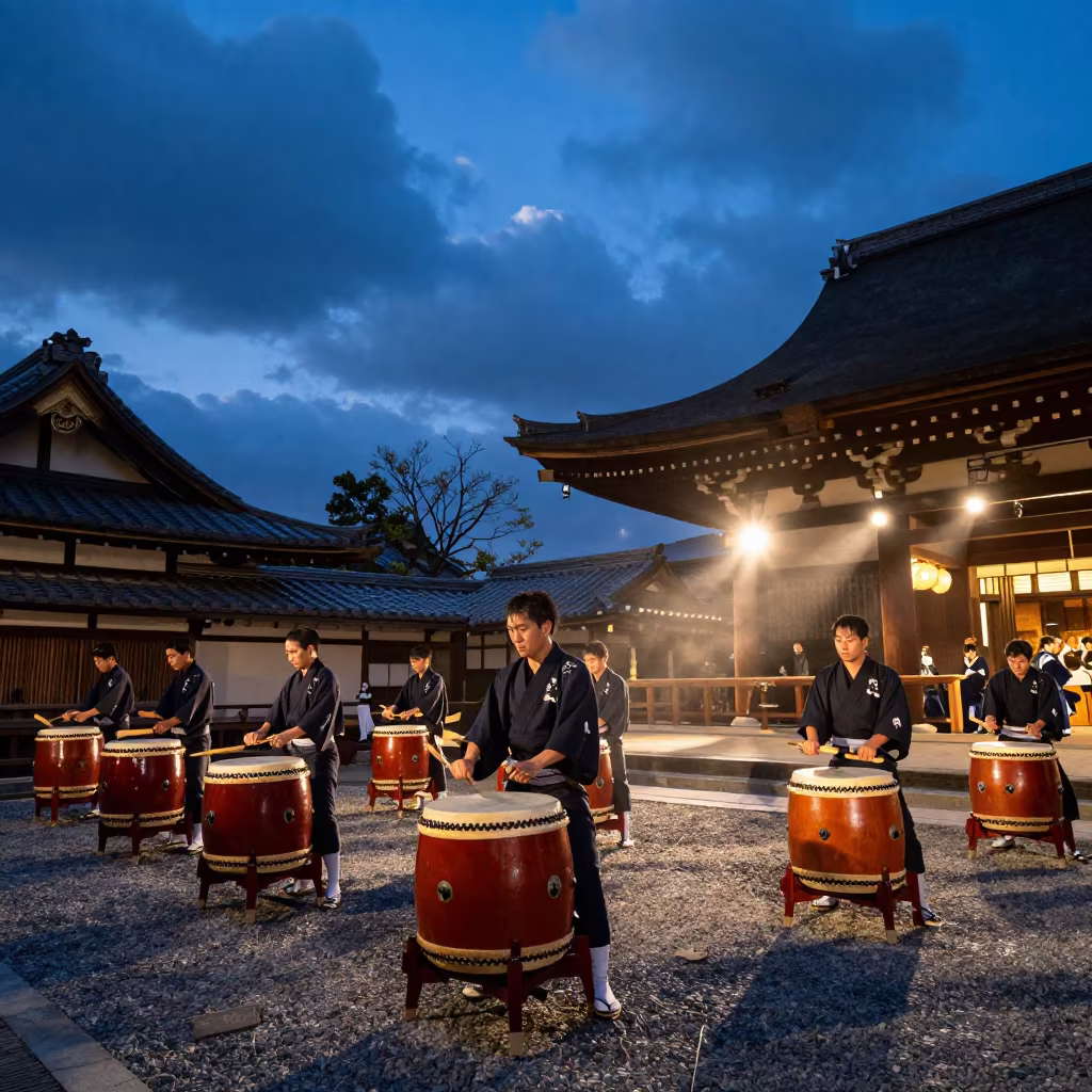 Taiko Drummers Strike in Kyoto Shrine Twilight in in a shrine courtyard in Kyoto