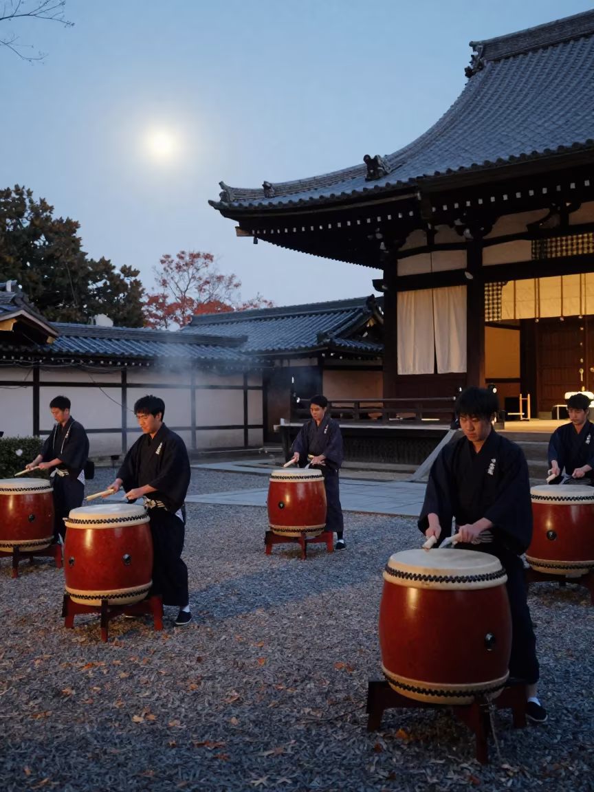 Taiko Drummers Strike Under Moonlight Kyoto Temple in in a temple precinct in Kyoto