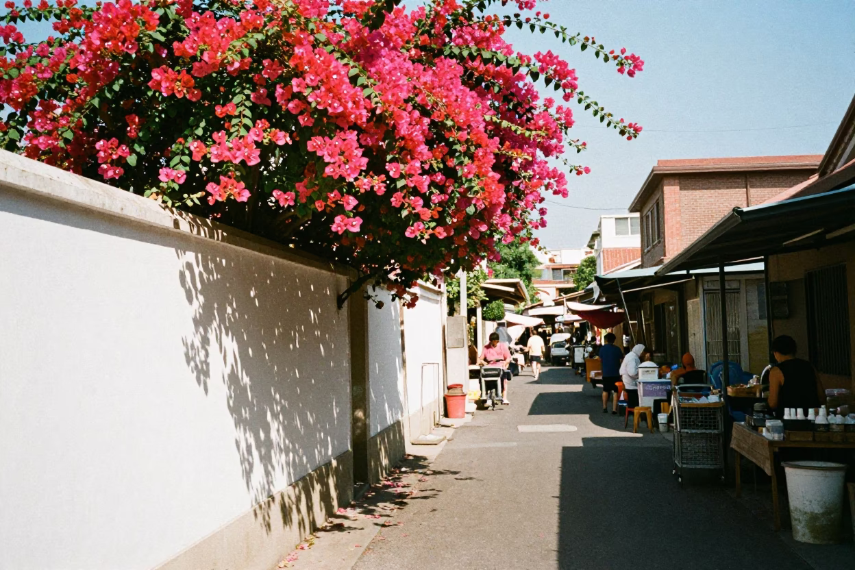Tainan Taiwan Noon Street Scene with Bougainvillea and Local Market Activity in in Tainan, Taiwan