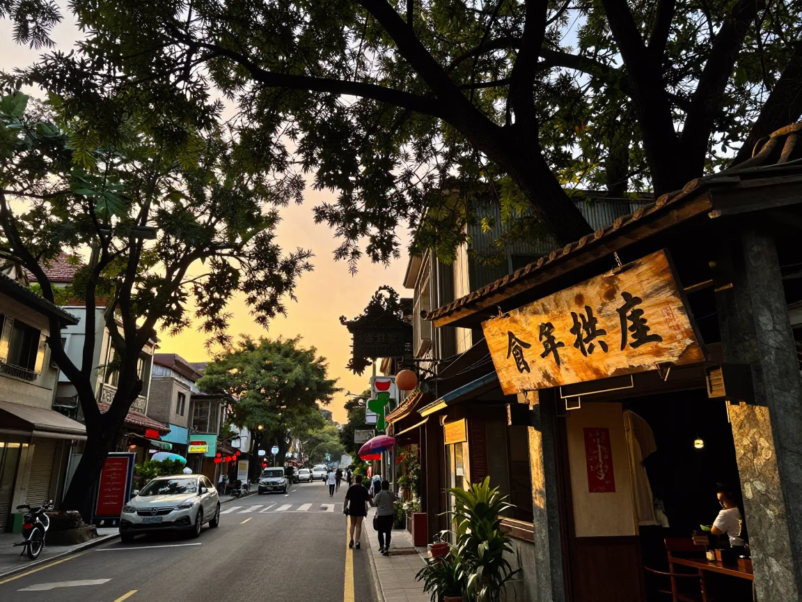 Taipei Taiwan Sunset Street Scene with Traditional Teahouse Signage and Crowded Sidewalk in in Taipei, Taiwan