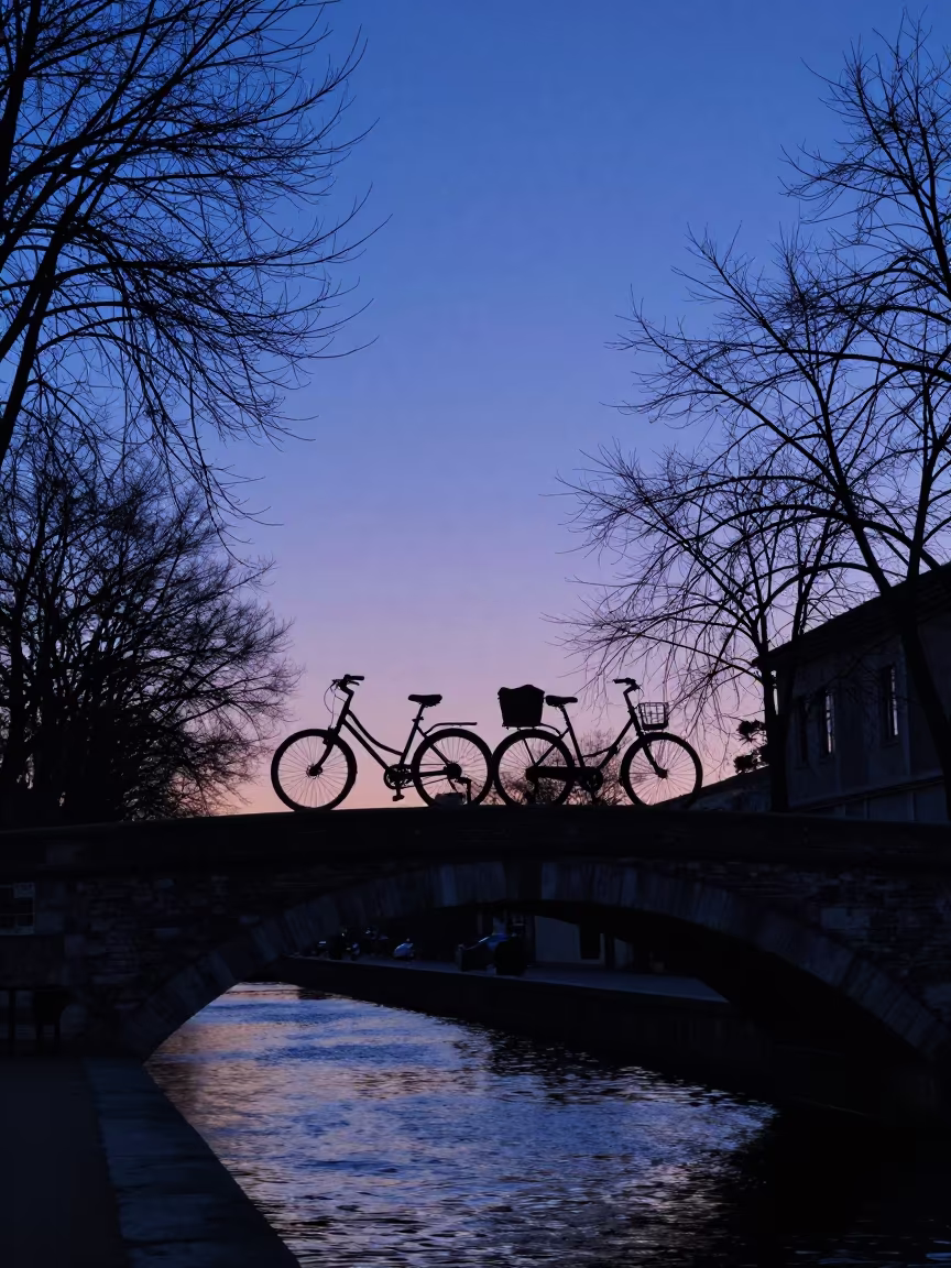 Silhouette of Tandem Bike on Spanish Canal Bridge in in Spain