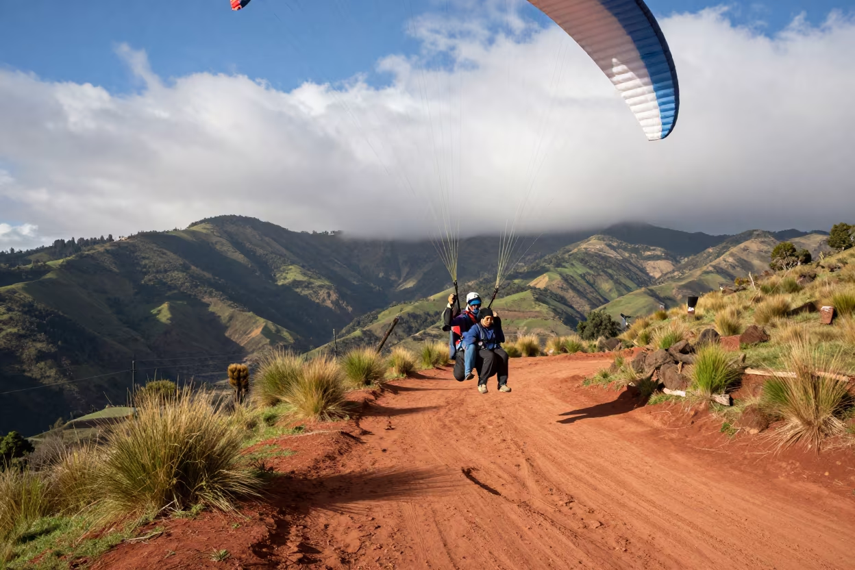 Tandem Paraglider Launch Over Cusco Valley in on a mountain path near Cusco