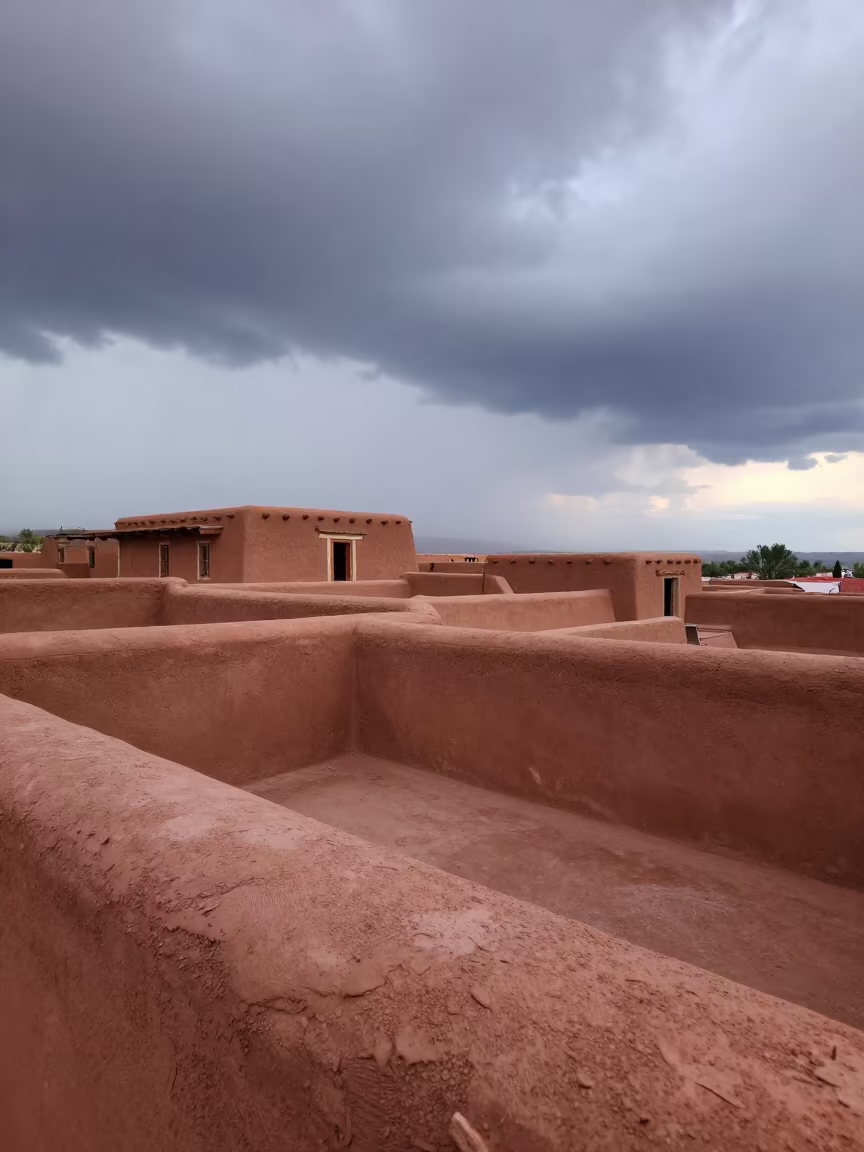 Taos Pueblo Terraces Under Morning Thunderstorm Sky in near Taos