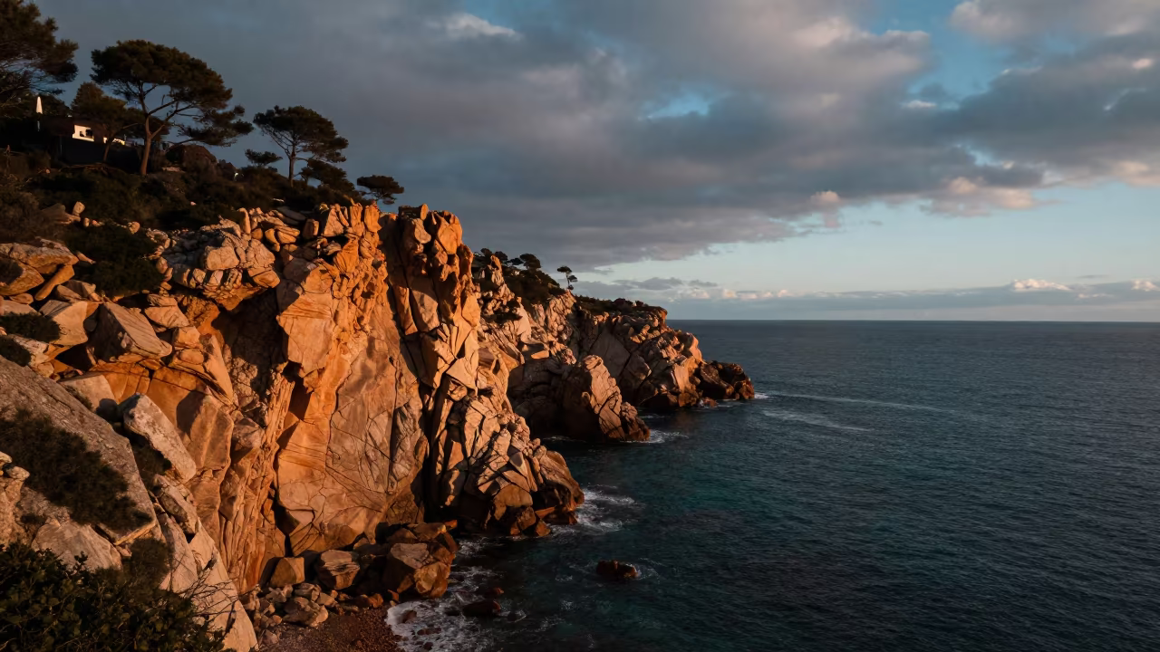 Teal Ocean Ochre Cliff Dawn Catalonia in along a wave-cut shoreline in Catalonia