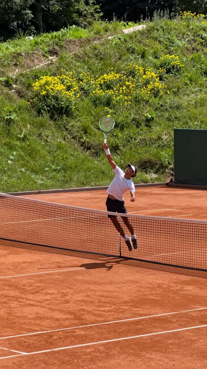 Tennis Player Smashing Overhead at Keur Massar Nord in on a hillside near Keur Massar Nord