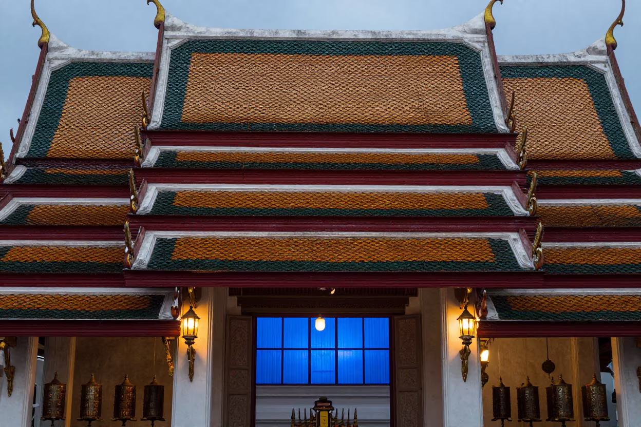 Thai Temple Roof Tiles in Cool Morning Light in beside a prayer wheel corridor in Phuket
