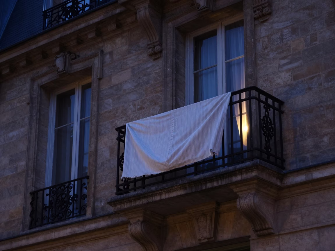 The Predawn Darkness Light on Parisian Balcony in in Paris, France