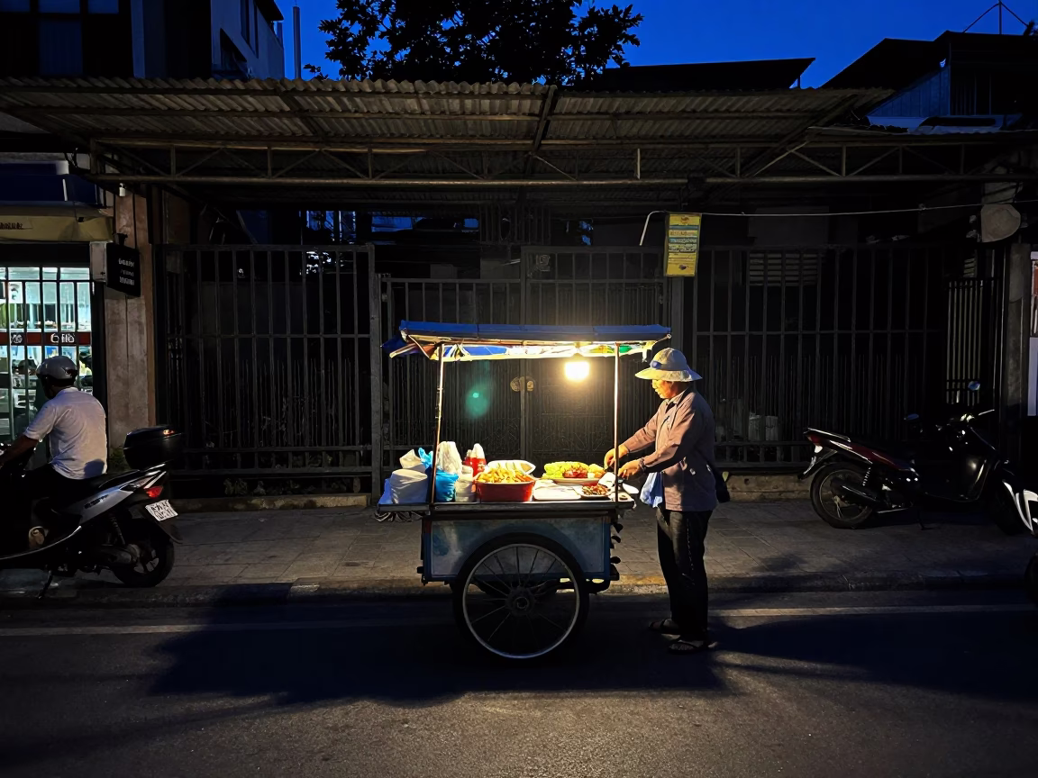 The Predawn Darkness Light on Street Vendor in Ho Chi Minh City in in Ho Chi Minh City, Vietnam