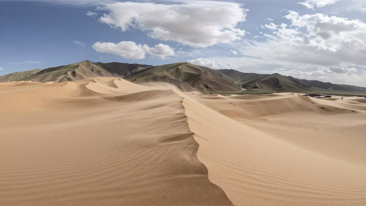 Tibetan Ridge Dune Wind Carved Midsummer Morning in from a ridge above layered foothills in Tibet