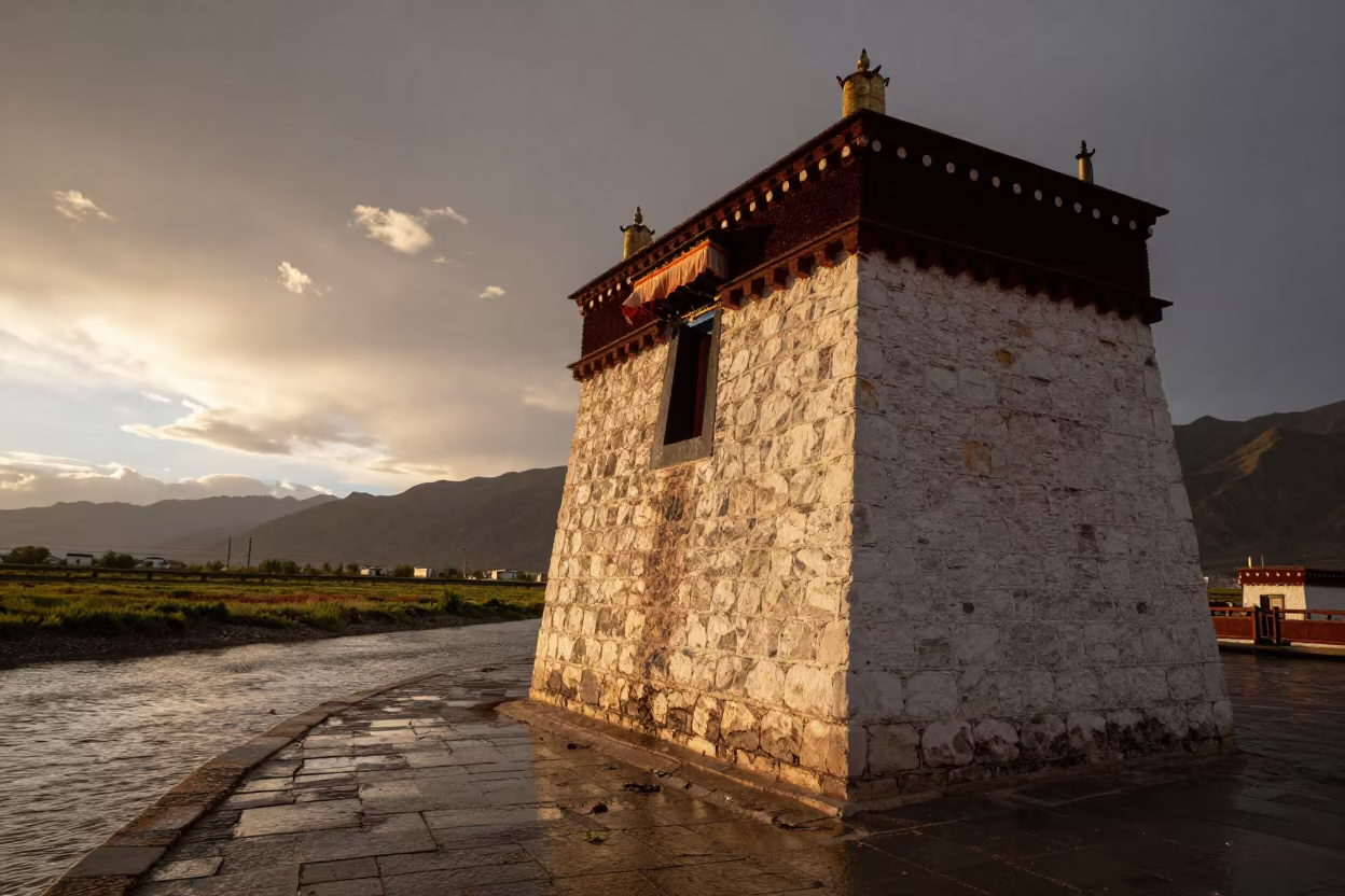 Tibetan Tower Beside Canal Under Storm Sky in beside a canal-front facade in Tibet