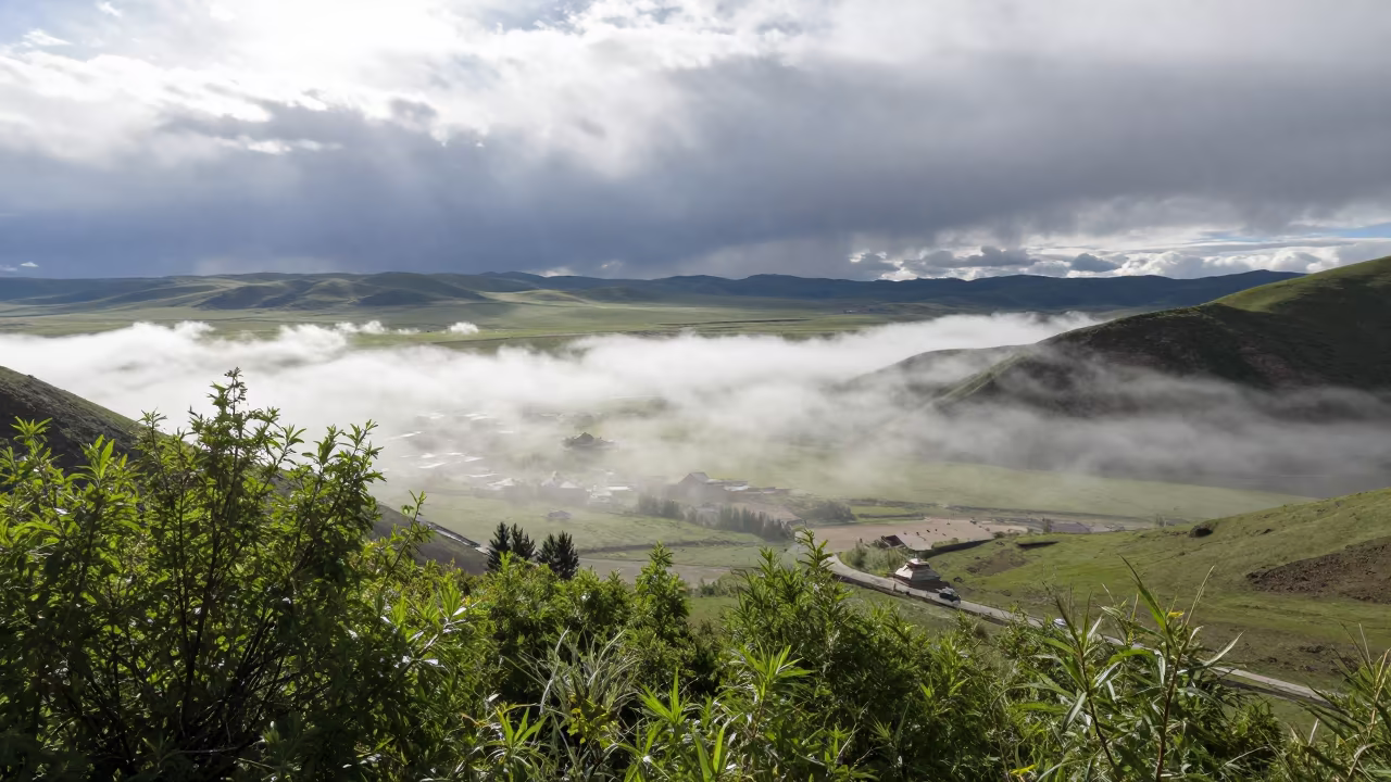 Tibetan Valley Mist Trapped Under Noon Sun in across a storm-bright plain in Tibet