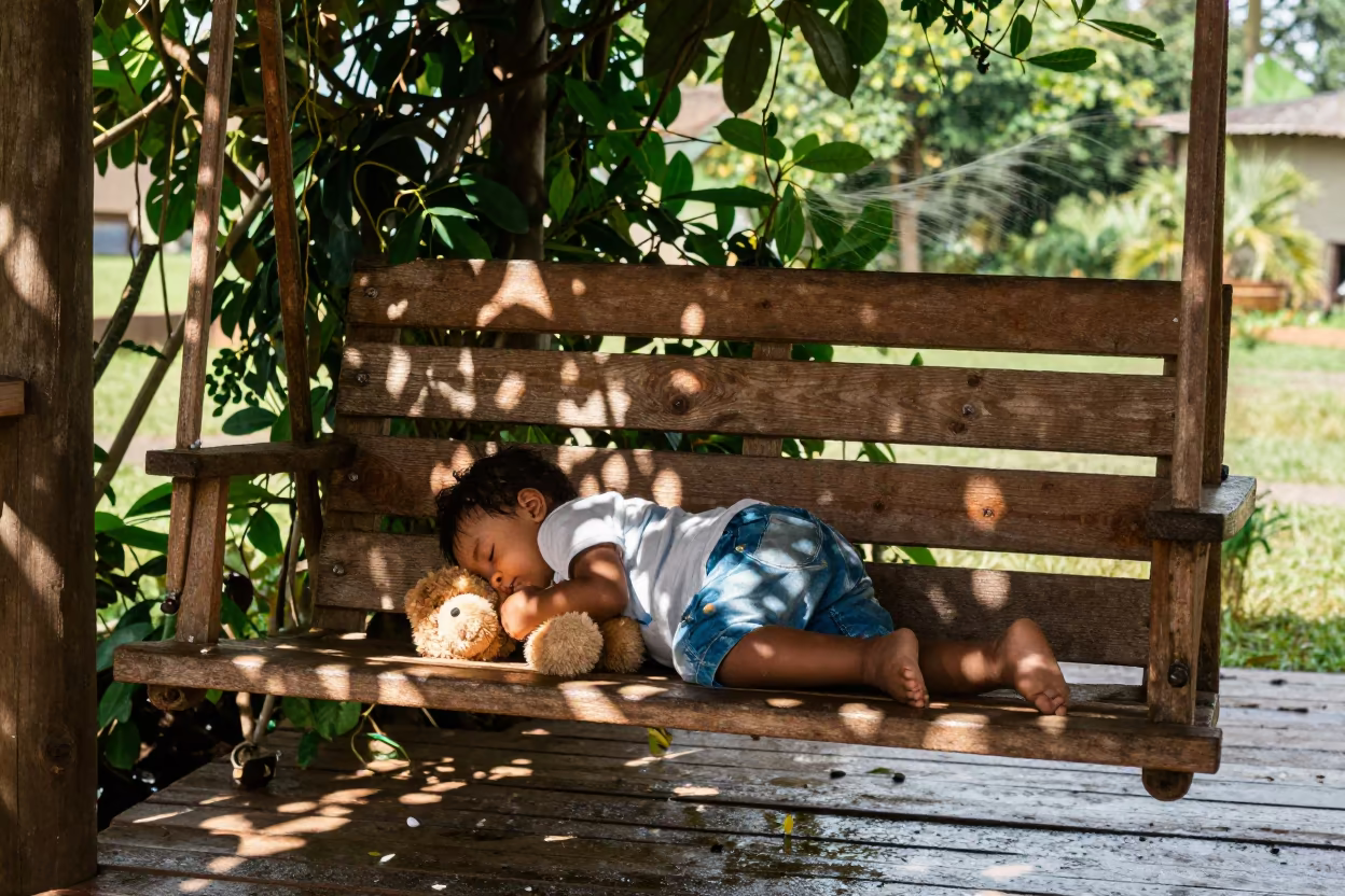 Toddler Sleeping on Porch Swing Near Mbuji-Mayi in near Mbuji-Mayi
