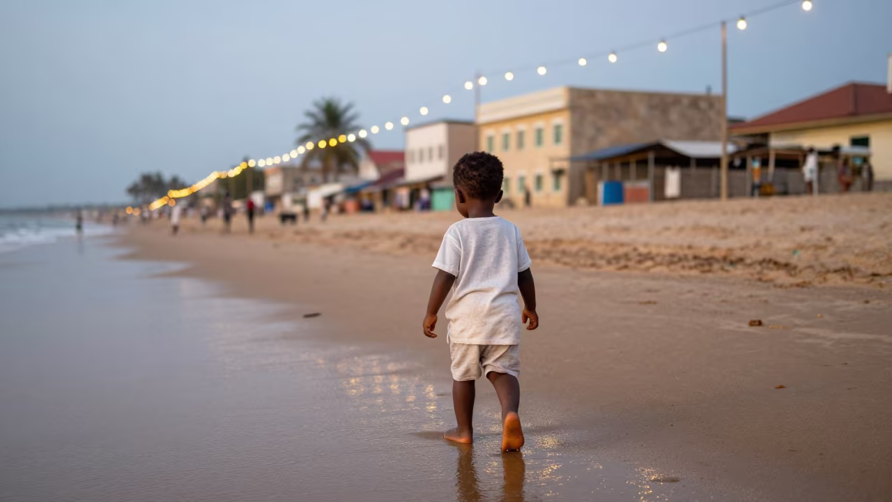 Toddler Walking Barefoot in Wet Sand Lagos Island in in the old quarter in Lagos Island, Lagos