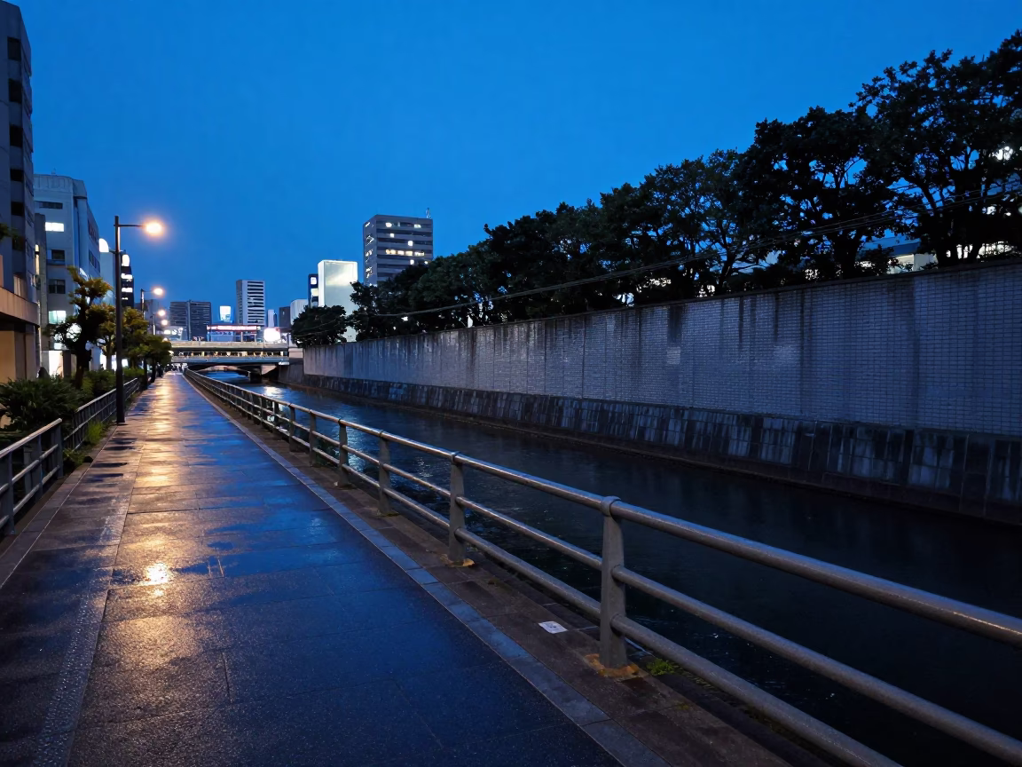 Tokyo Blue Hour Street Scene with Levee Path and Urban Wall Smudges in in Tokyo, Japan