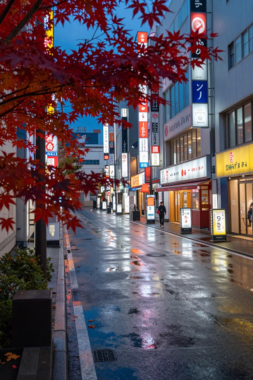 Tokyo evening street scene with neon glow and traditional Japanese maple in autumn in in Tokyo, Japan