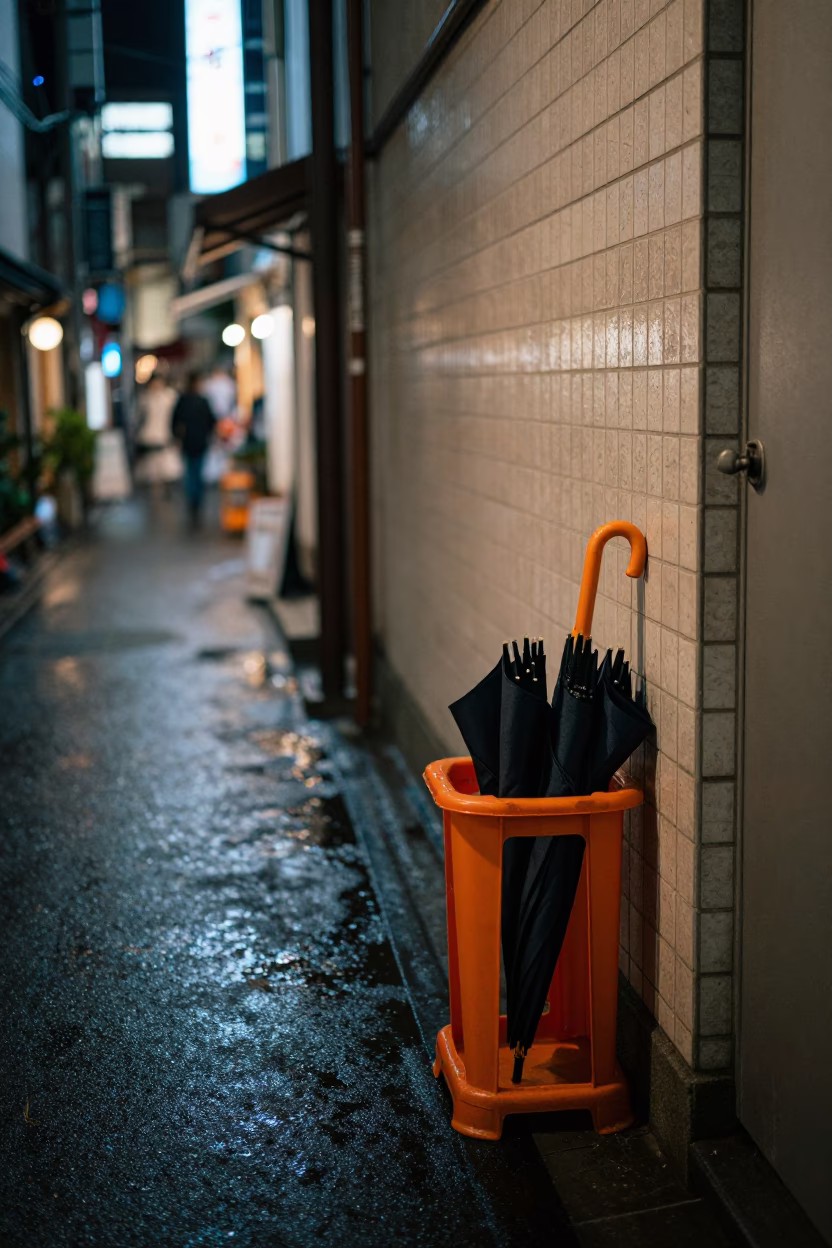 Tokyo Night Alley with Umbrella Stand and Clothes Brush Near Convenience Store in in Tokyo, Japan