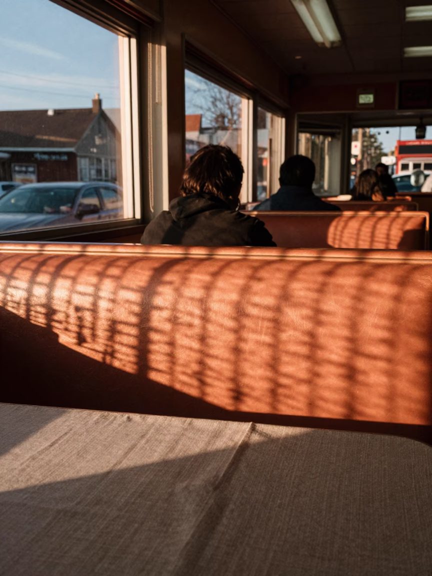 Toronto Diner Interior with Wicker Shadows and Linen Texture in Copper Evening Light in in Toronto, Ontario, Canada