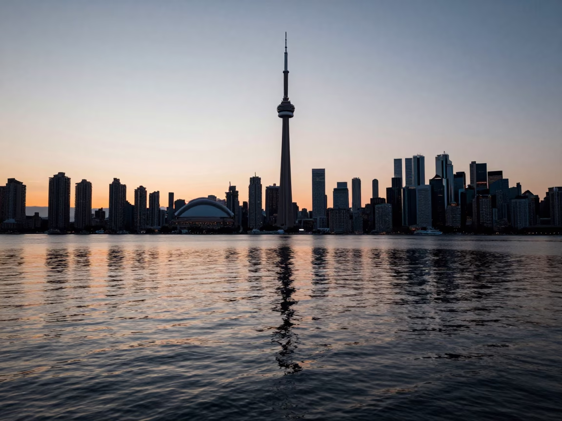 Toronto Harbor Dawn First Light Reflecting on Water and City Skyline in in Toronto, Ontario, Canada