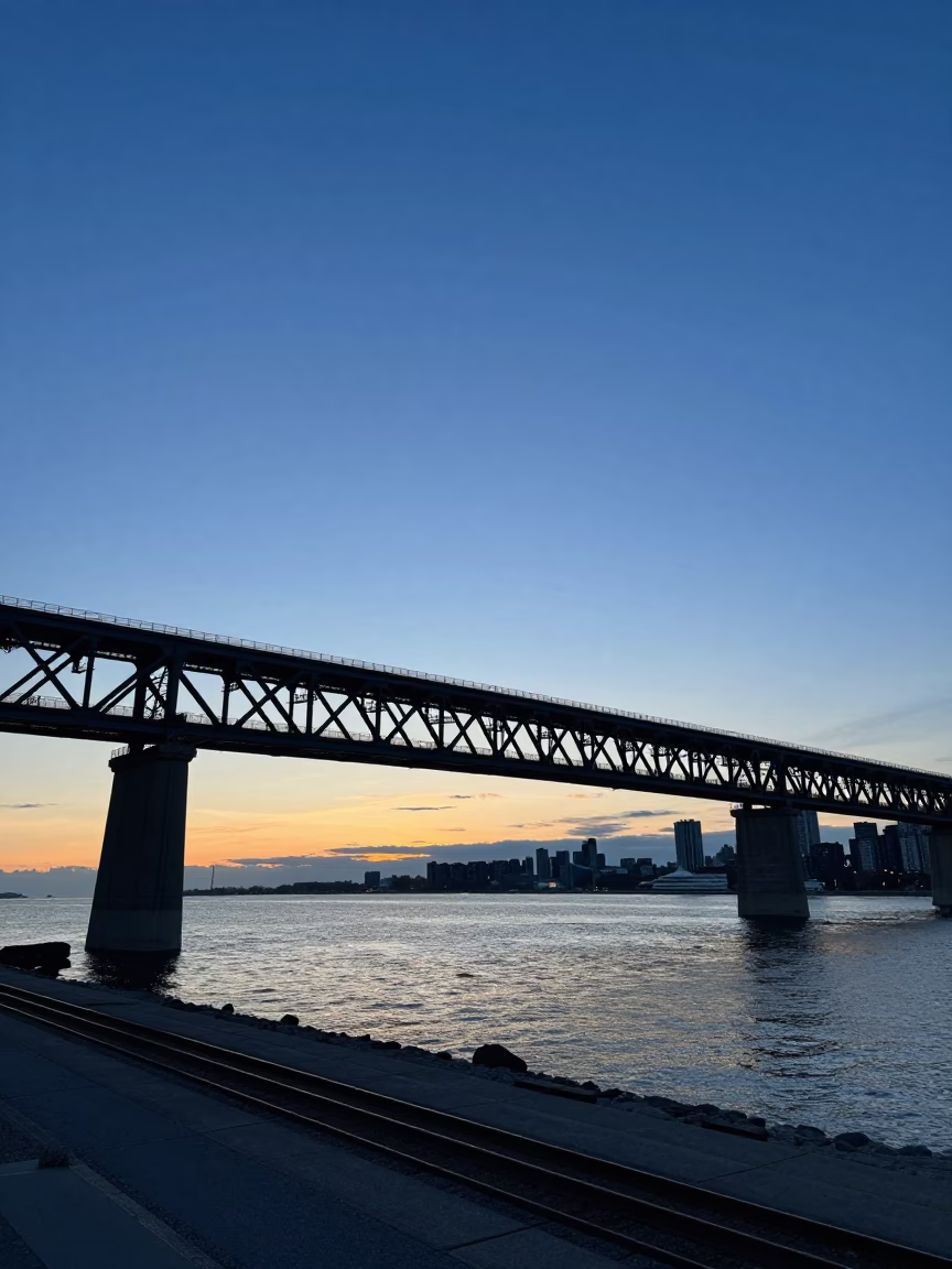 Toronto Harborfront Dusk with Blue Hour Sky and Railway Viaduct Arches in in Toronto, Ontario, Canada