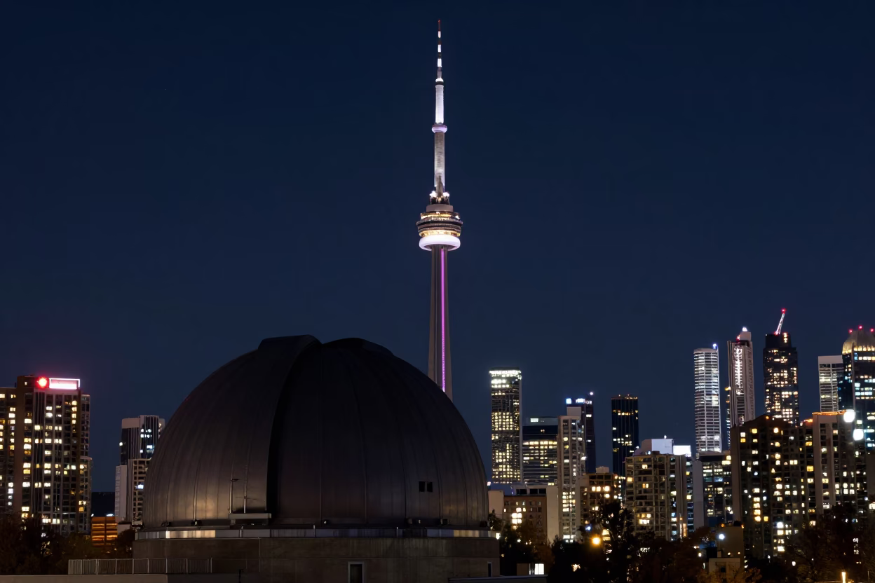 Toronto Night Sky Observatory Dome Silhouette and Urban Lights Reflection in in Toronto, Ontario, Canada