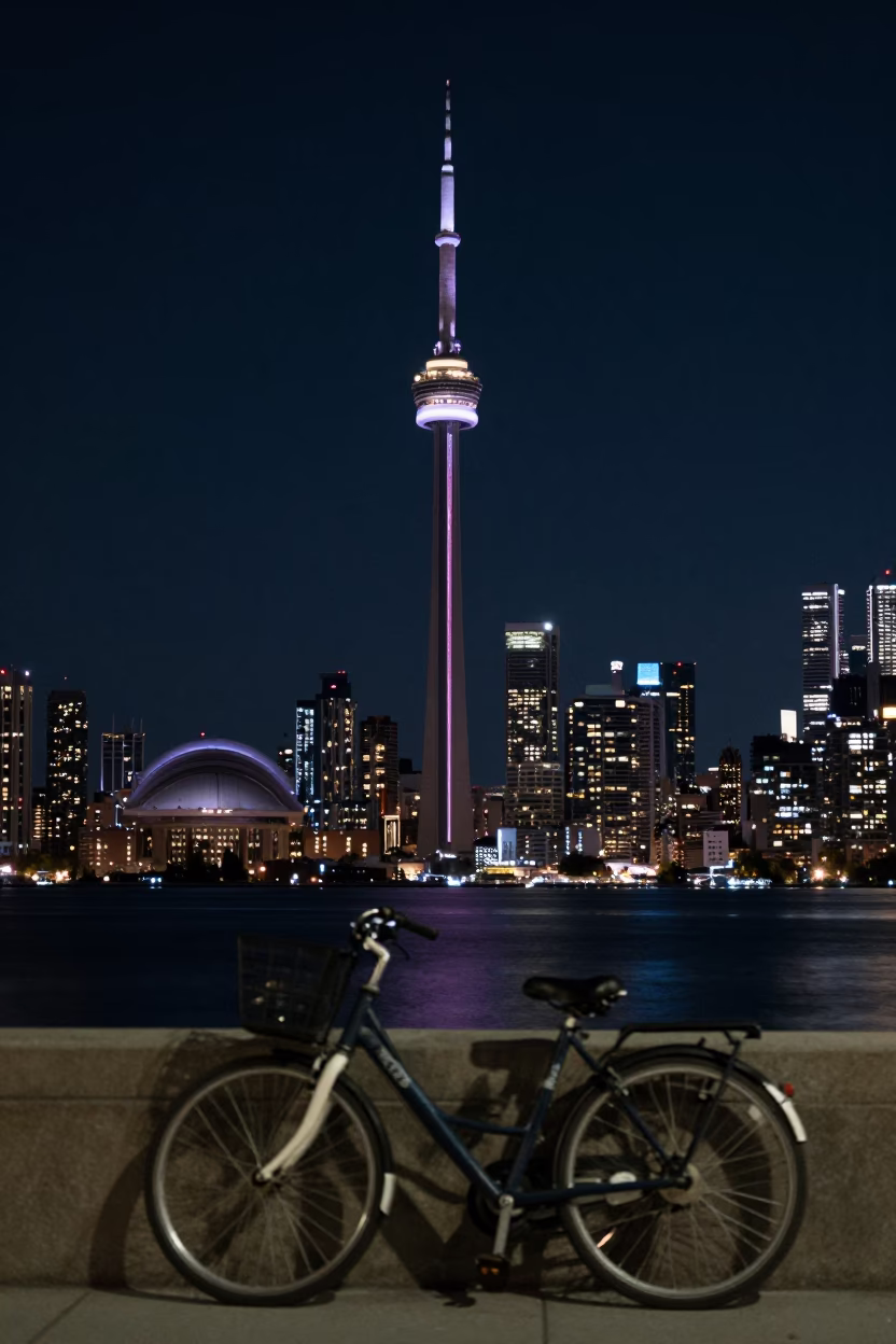 Toronto Night Skyline Under Deep Darkness With Bicycle And Urban Street Scene in in Toronto, Ontario, Canada