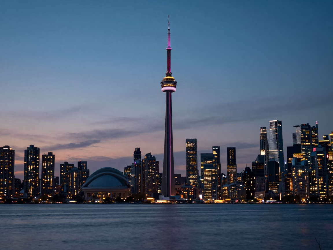 Toronto Skyline at Dusk from Harbourfront Park with City Lights and Waterfront Walkway in in Toronto, Ontario, Canada