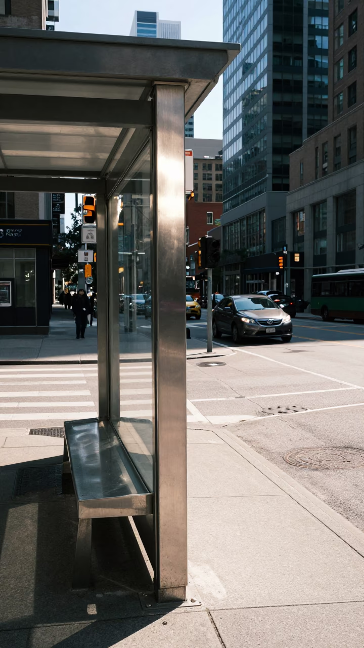 Toronto street corner noon light brushed steel edge and smudges on runner in in Toronto, Ontario, Canada