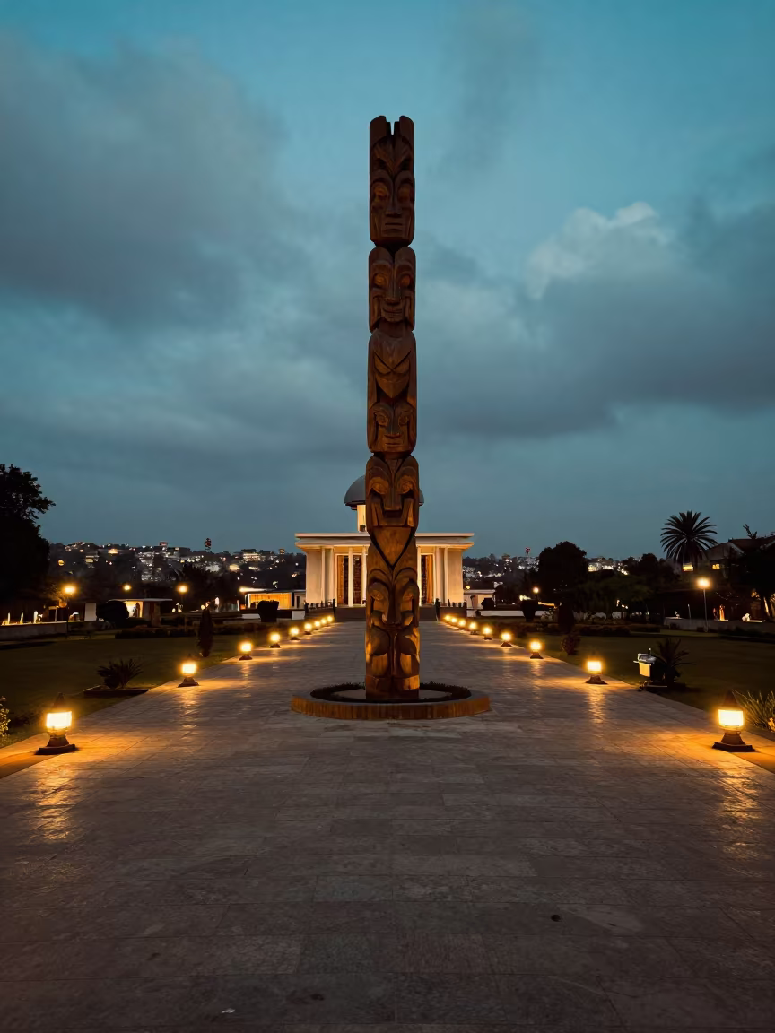 Totem Pole Lined Lanterns Yamoussoukro Dusk in in a shrine lined with lanterns in Yamoussoukro