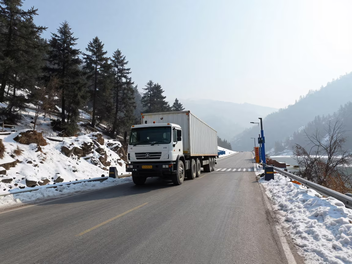 Tractor Trailer on Alpine Ferry Crossing Winter in across a remote ferry crossing in Himachal Pradesh