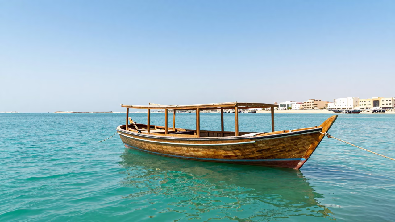 Traditional Dhow Boat Moored in Muscat Corniche Waterway Under Bright Midday Sun in in Muscat, Oman