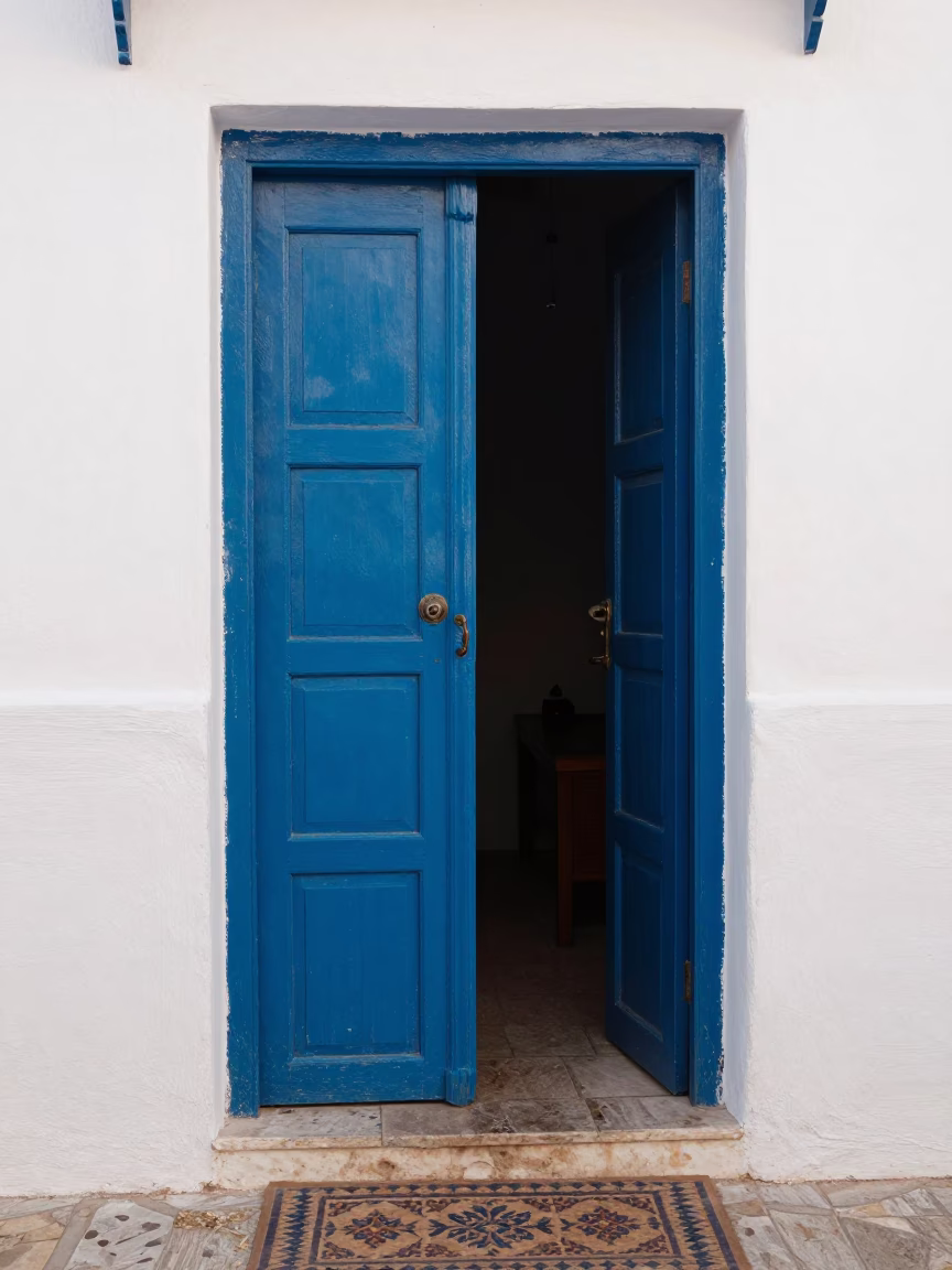 Traditional Moroccan Doorway with Decorative Doormat in Late Afternoon Essaouira in in Essaouira, Morocco