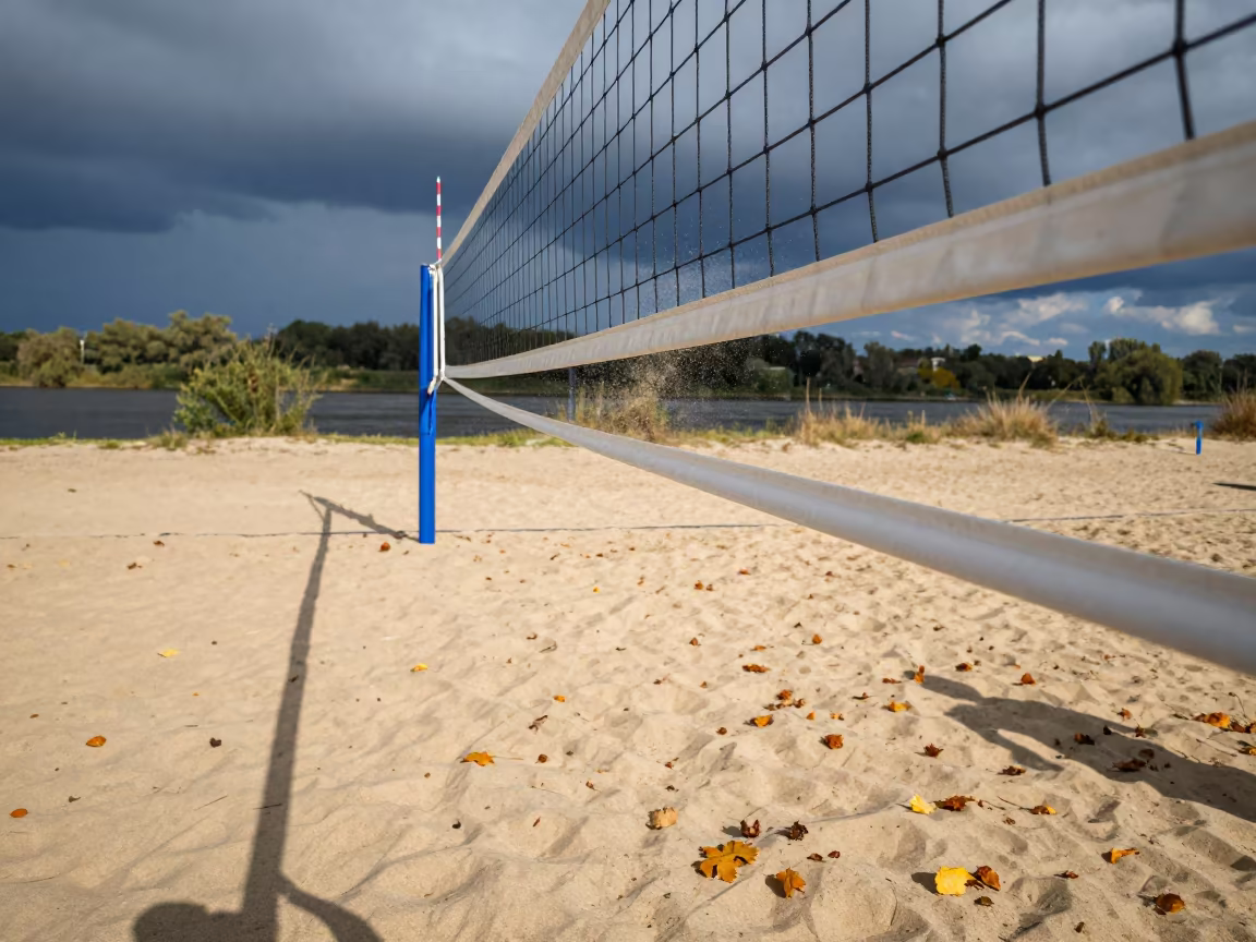Trembling Volleyball Net Over Autumn Sand in by a riverbank near Łódź