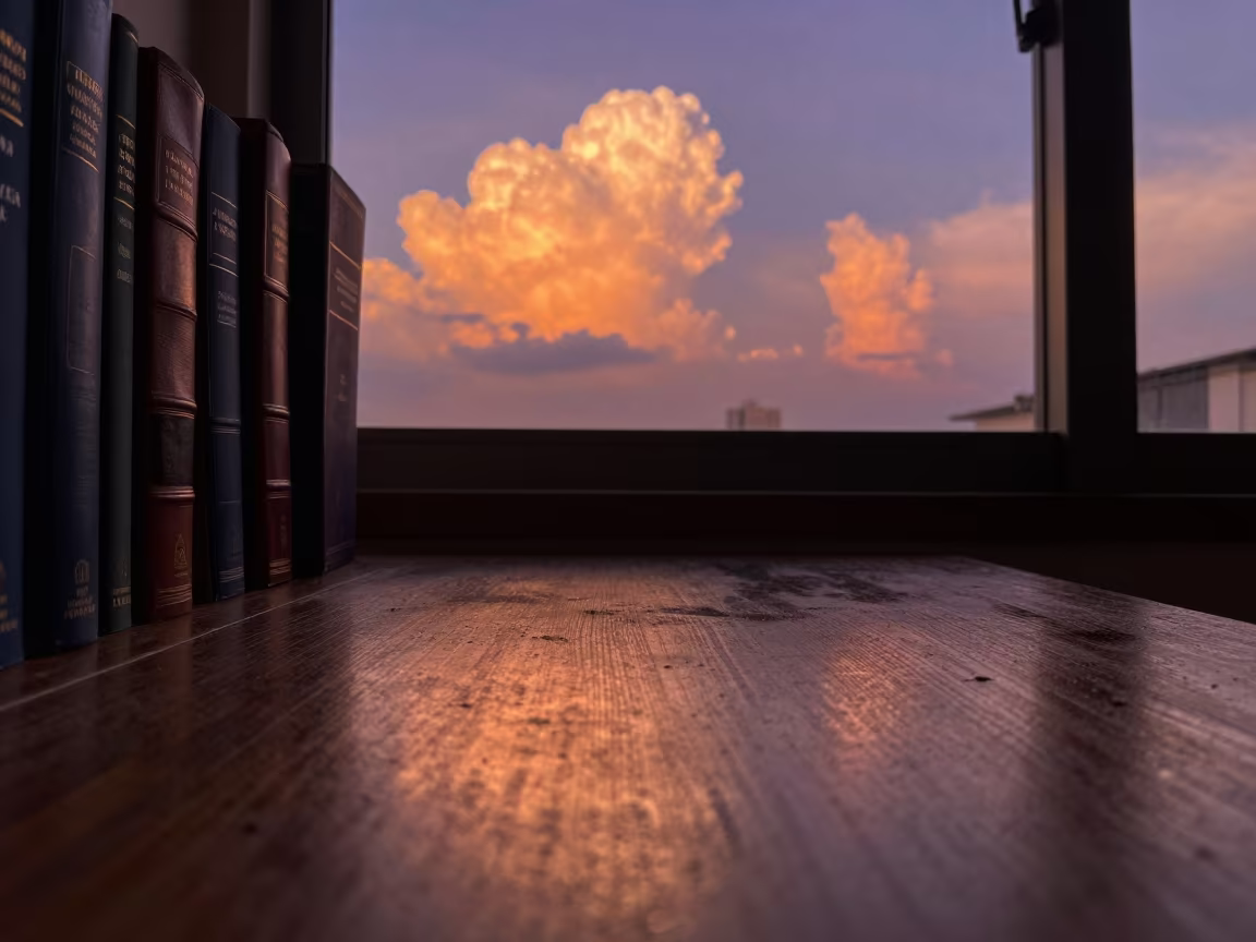 Tropical Sunset Reflections on Dusty Library Table in on a dusty library table in Kuala Lumpur