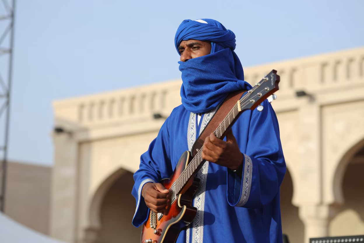 Tuareg Guitarist Playing Under Clear Sky in on a festival main stage in Amman