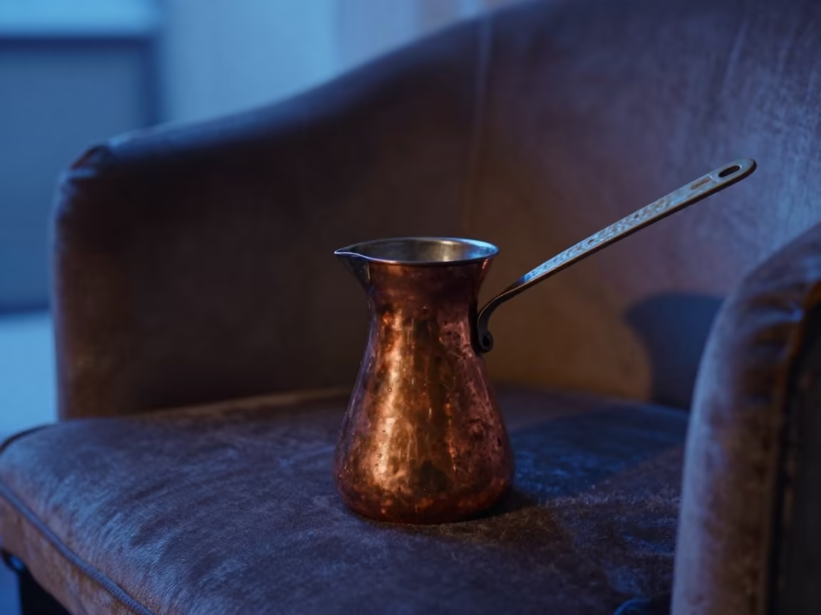 Turkish Mocha Copper Pot on Velvet Chair in on a velvet chair in Lira
