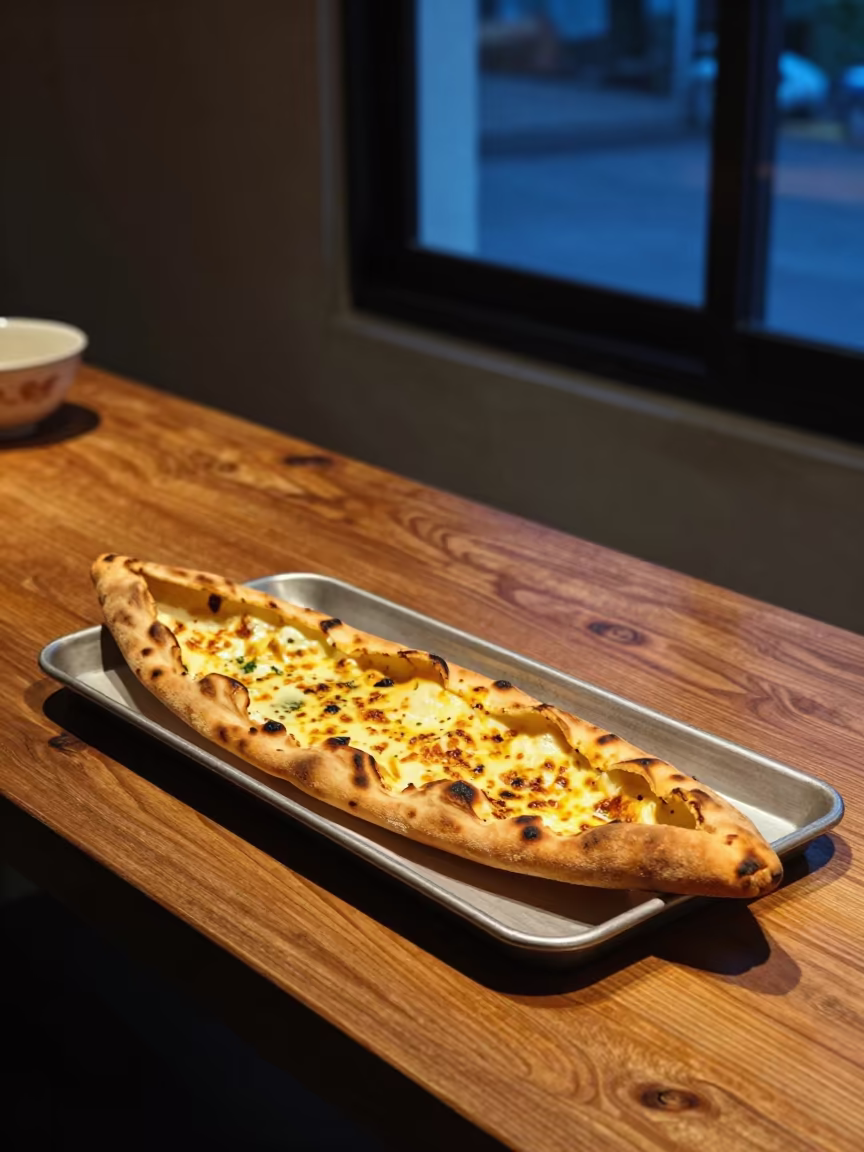 Turkish Pide Fresh from Stone Oven on Bangkok Bench in on a wooden workbench near Bangkok