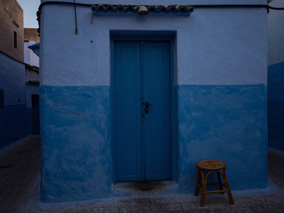 Turquoise Blue Door And Rattan Stool in Essaouira in in Essaouira, Morocco
