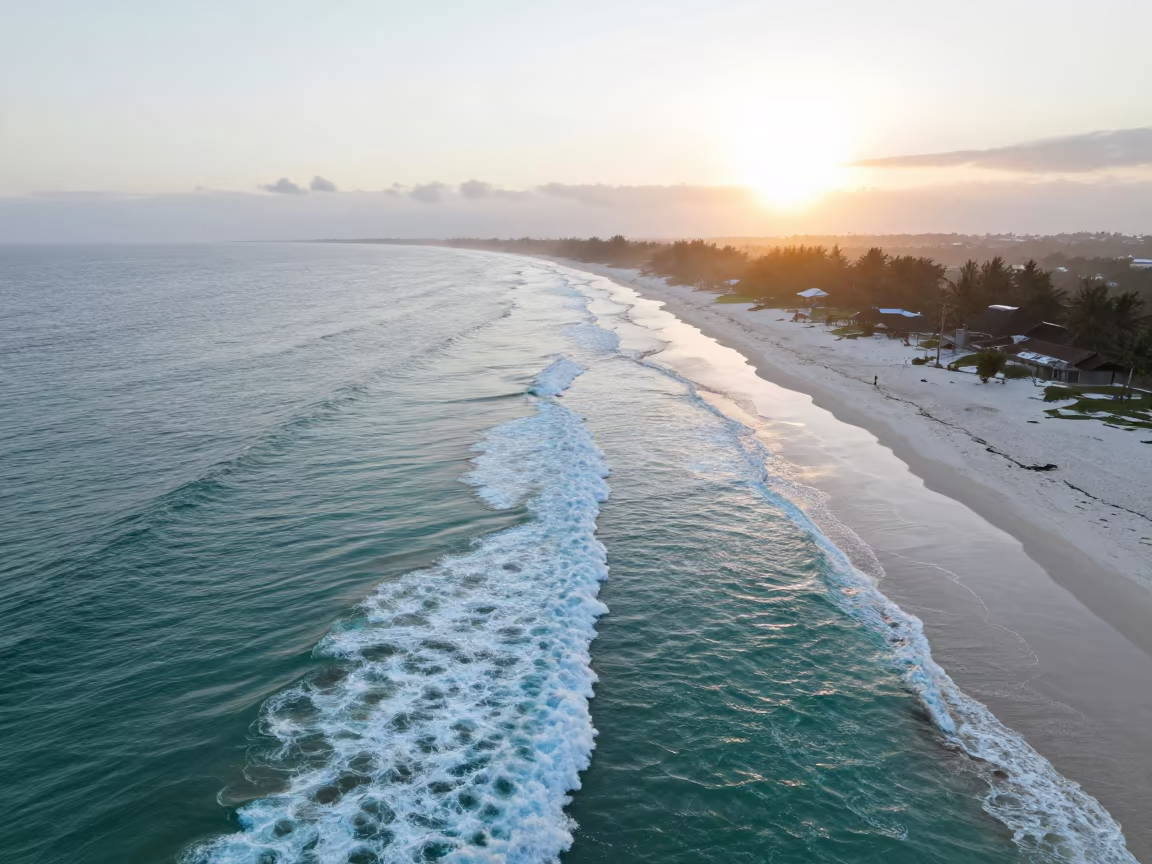 Turquoise Waves Breaking on White Sand at Dawn in near Livingstone