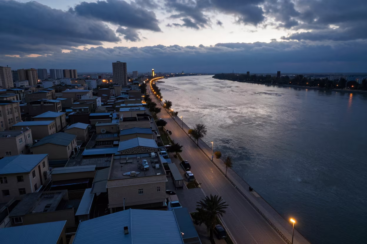 Twilight Aerial View Tajikistan Waterfront Promenade in high above patterned rooftops in Tajikistan