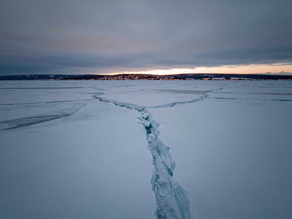 Twilight Pressure Ridges Arctic Sea Ice Aerial View in far above surf-scalloped coastline in Alberta