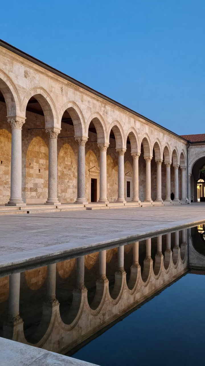 Twilight reflections on Bosnian archive facade in along a colonnaded facade in Bosnia and Herzegovina